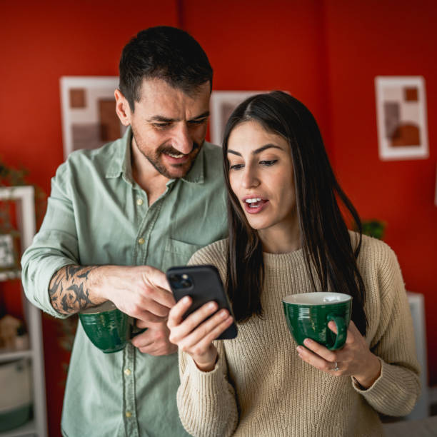 A person using a smartphone in a cozy home environment